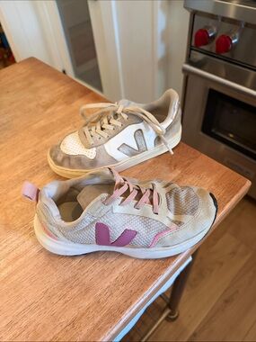 TWO pairs of Vejas